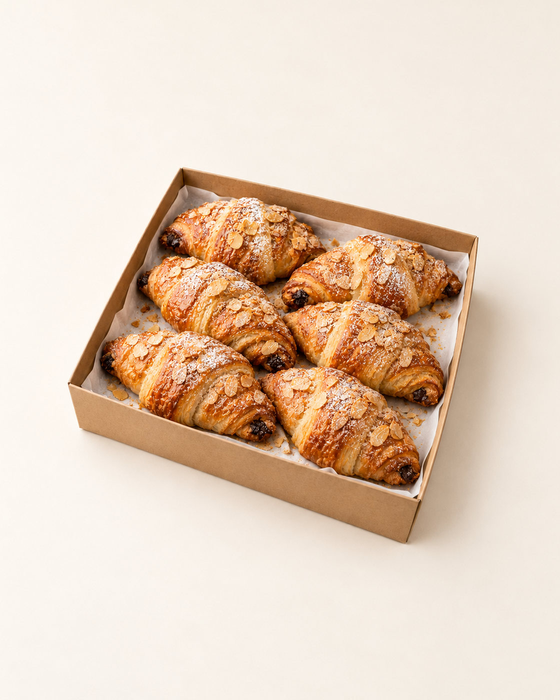 Illustrative serving suggestion: 6 Chocolate & Almond Croissants in a brown kraft catering platter.