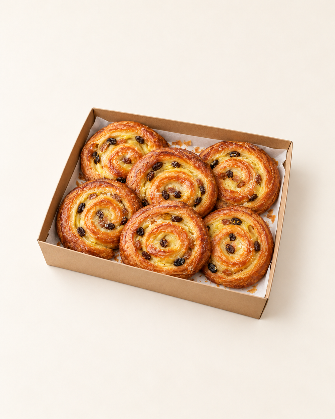 Illustrative serving suggestion: 6 Pain aux Raisins in a brown kraft catering platter.