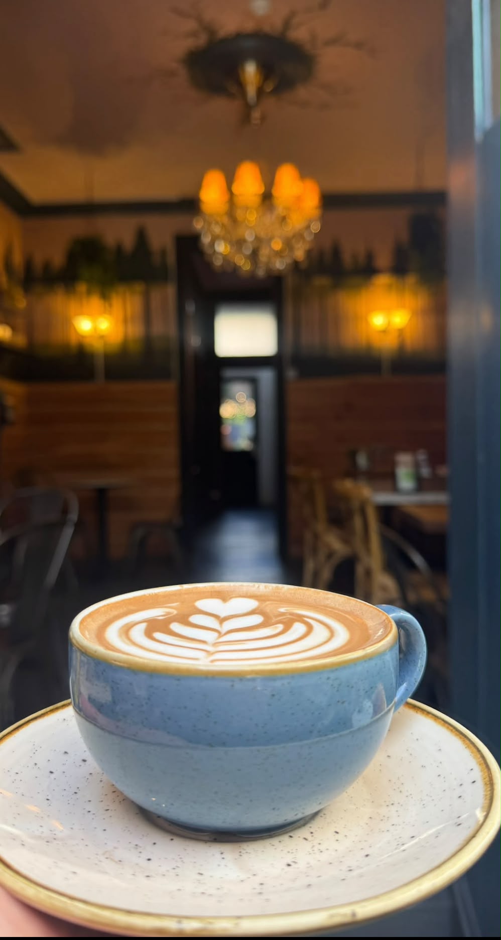 A flat white in a blue cup at Forty Eight