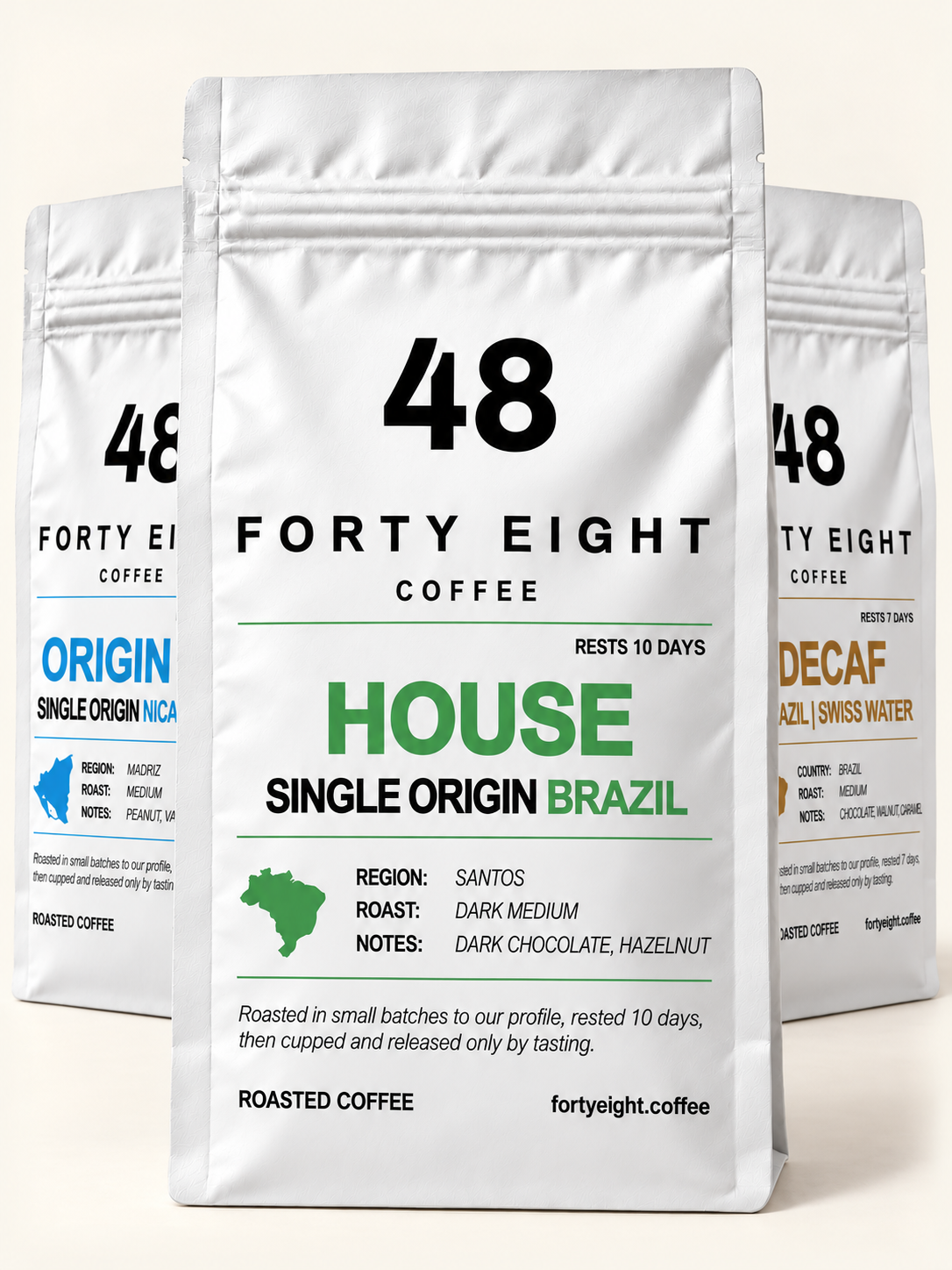 HOUSE foreground pouch with ORIGIN 02 and DECAF staggered behind — matte white direct print